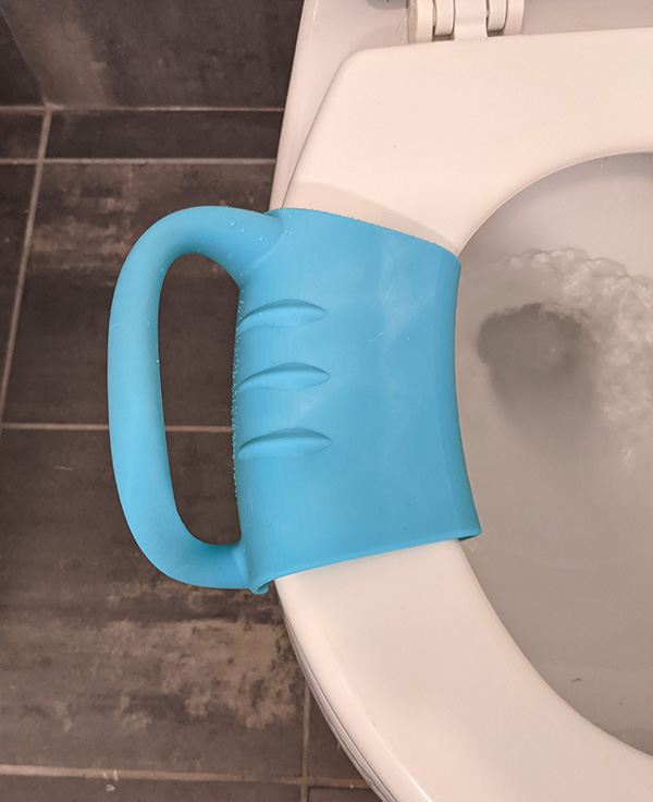 Turquoise handle on toilet seat